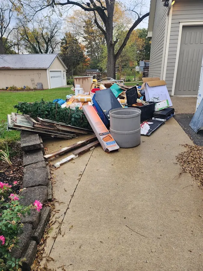 Dumpster being loaded with debris for Commercial Dumpster Rental in Oakdale